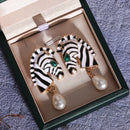 🎁   Brinco Zebra Feminina